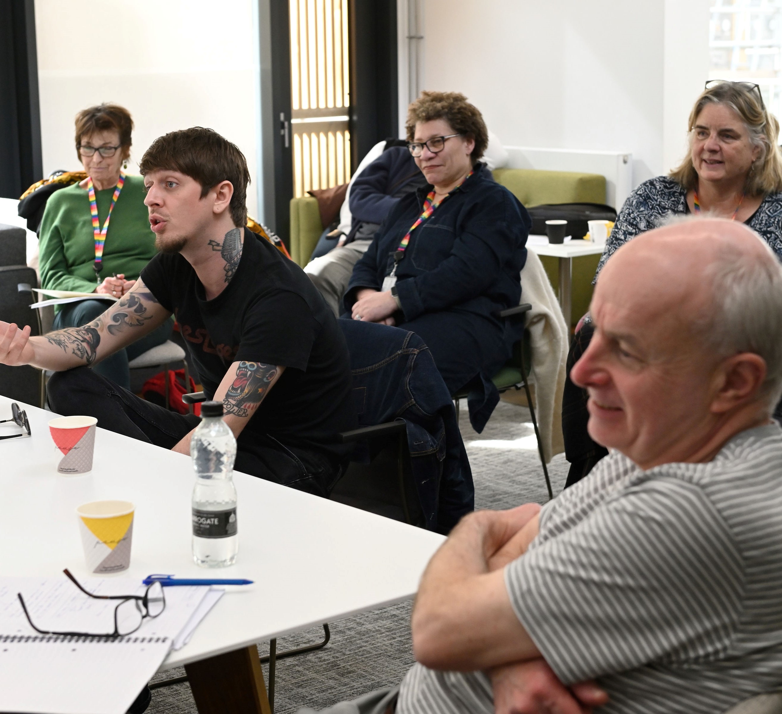 A group of mature students in a classroom in discussion